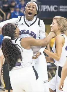  ??  ?? Winchester Thurston’s Gia Thorpe celebrates with her teammates after beating West Greene in the WPIAL Class 1A girls game at Petersen Events Center.