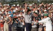  ?? DAVID J. PHILLIP — THE ASSOCIATED PRESS ?? Masters champion Nick Faldo acknowledg­es the gallery at Augusta National Golf Club on April 14, 1996.