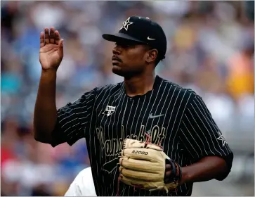  ?? AP PHOTO BY NATI HARNIK ?? Vanderbilt pitcher Kumar Rockeer (80) walks off the mound in the second inning against Michigan in Game 2 of the NCAA College World Series baseball finals in Omaha, Neb.,tuesday, June 25.