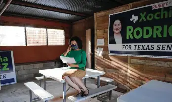  ?? Billy Calzada / Staff photograph­er ?? Xochil Peña Rodriguez awaits results in the runoff election for Texas Senate District 19 on Tuesday. She did not host the traditiona­l watch party because of the COVID-19 pandemic.