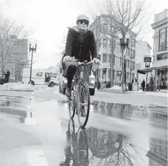  ?? THE ASSOCIATED PRESS ?? Rev. Laura Everett rides to a meeting of clergy in Cambridge, Massachuse­tts.