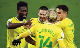  ??  ?? Norwich’s Emi Buendía (second left) celebrates with teammates after scoring the winner against Nottingham Forest at Carrow Road. Photograph: Joe Giddens/PA