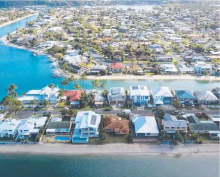  ??  ?? The property at 16 Marlin Crt, Palm Beach (centre, brown roof) sold for just over $1 million at auction.