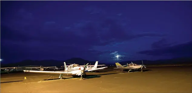  ?? File photo ?? Taos Municipal Airport at night in 2011. Four decades earlier, the first charter flights launched from the airport, but the service ended after a few years.