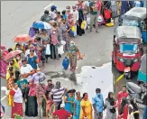  ?? AFP ?? People queue up to buy kerosene in Colombo on Tuesday.