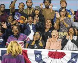  ?? PHOTOS BY ALYSSA POINTER / ALYSSA.POINTER@AJC.COM ?? Crowd members applaud after a speech during the rally. Those in attendance at Morehouse included students from Atlanta University Center schools at what was, for many, their first political event.