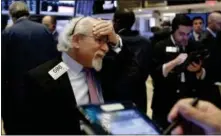  ?? RICHARD DREW — THE ASSOCIATED PRESS ?? Trader Peter Tuchman works on the floor of the New York Stock Exchange, Tuesday.