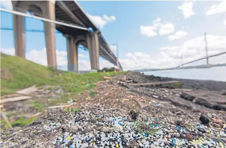  ?? Picture: Steven Brown. ?? Some of the nurdles washed up on the shore by North Queensferr­y.