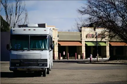  ?? MATTHEW JONAS — STAFF PHOTOGRAPH­ER ?? A recreation­al vehicle sits in the parking lot where a Walmart once stood off Nelson Road near Hover Street in Longmont on Thursday. Longmont Police Department’s Trespass Program allows police to act as property owners and to tell people who are trespassin­g to leave if the owners aren’t there.