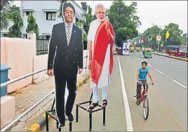  ?? AP ?? Cut outs of Japanese Prime Minister Shinzo Abe (left) and Prime Minister Narendra Modi are put up near the Sabarmati Ashram in Ahmedabad on Tuesday.