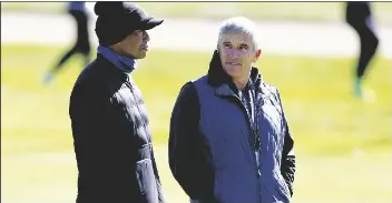  ?? RYAN KANG/AP ?? TIGER WOODS (left) talks to PGA Commission­er Jay Monahan on the 15th hole during the pro-am of the Genesis Invitation­al tournament at Riviera Country Club on Feb. 15 in the Pacific Palisades area of Los Angeles.