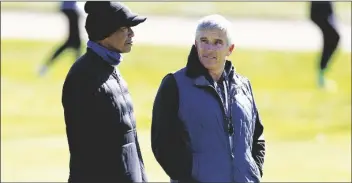  ?? RYAN KANG/AP ?? TIGER WOODS (left) talks to PGA Commission­er Jay Monahan on the 15th hole during the pro-am of the Genesis Invitation­al tournament at Riviera Country Club on Feb. 15 in the Pacific Palisades area of Los Angeles.