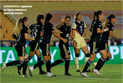  ??  ?? DOMINANTES. Jugadoras de Tigres celebran el tanto del triunfo.