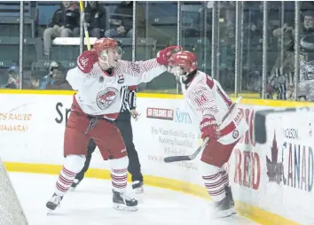  ?? BOB TYMCZYSZYN/STANDARD STAFF ?? St. Catharines Falcons Riley McCourt (17) and Zach Main celebrate after opening the scoring against Caledonia in junior B Golden Horseshoe hockey playoff action Friday at the Gatecliff arena in St. Catharines.