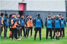  ?? AFP ?? Belgium’s head coach Roberto Martinez (fourth from right) addresses his players during a training session.