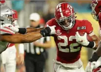  ?? Kevin C. Cox/Getty Images ?? Alabama running back Najee Harris exploded for the Crimson Tide's first three touchdowns in the CFP Championsh­ip game Monday at Hard Rock Stadium in Miami Gardens, Fla.