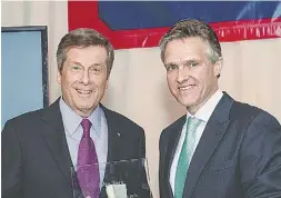  ??  ?? Toronto Mayor John Tory and Rod Phillips,
chairman of CivicActio­n.