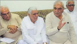  ?? HT PHOTO ?? Former chief minister Bhupinder Singh Hooda (2nd R) with Congress leaders (from left) Anand Singh Dangi, Raghuvir Singh Kadian and Shadi Lal Batra at a press conference in Rohtak.