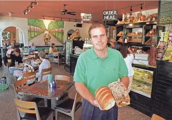  ?? ?? Pete Holloway, patriarch of the Holloway family and co-founder of the Holloway Restaurant Group, is seen inside Cafe 501 in Edmond in this The Oklahoman photo from 2010. THE OKLAHOMAN FILE