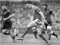  ??  ?? Ireland’s fly half Johnny Sexton kicks forward during the Six Nations internatio­nal rugby union match between Ireland and France at Aviva Stadium in Dublin, Ireland on February 14, 2015. - AFP photo