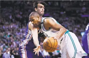  ?? Charles Krupa / Associated Press ?? Al Horford, right, drives to the basket against the 76ers’ Dario Saric on Wednesday.