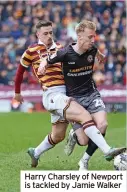  ?? ?? Harry Charsley of Newport is tackled by Jamie Walker