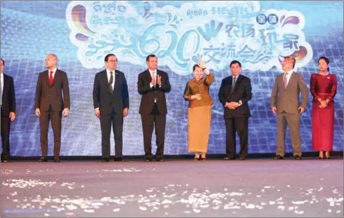  ?? HENG CHIVOAN ?? Deputy Prime Minister Men Sam An (centre) waves at the ceremony to kick off the Wisney World project in the capital on Wednesday.