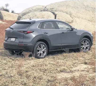  ??  ?? Designed at Mazda’s European design studio in Frankfurt, by a team led by a new father, the CX-30 is 12 cm longer than the CX-3. The wheelbase is 8.4 cm longer and that extra space has been allocated to the rear seat and trunk areas.
