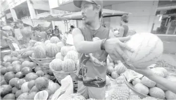  ?? FILE PHOTO ?? A wide variety of fruits is sold at reasonable prices on the streets outside Cebu City's Carbon Public Market.