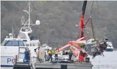  ?? — Reuters ?? NSW police and salvage personnel recover the wreckage of a seaplane that crashed into Jerusalem Bay, north of Sydney, on Thursday.