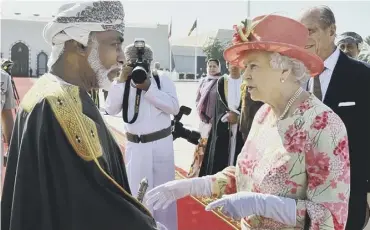  ??  ?? 0 The Sultan shakes hands with the Queen in Muscat during her visit to the Gulf states