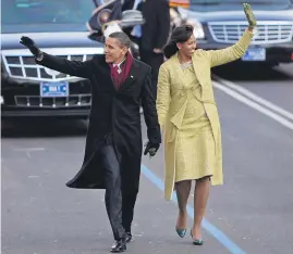  ?? Picture / AP ?? Barack and Michelle Obama walk part of the way to the White House on the day of his inaugurati­on, eight years ago.