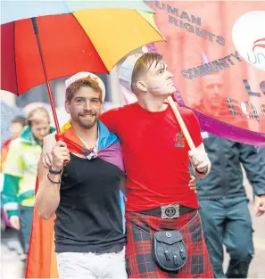  ?? Photograph­s: Robert Perry ?? Pride supporters march in Glasgow yesterday