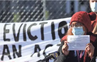  ?? JOE RONDONE/ COMMERCIAL APPEAL ?? Bluu Davis speaks outside of City Hall Wednesday about being served an eviction notice as she joins the Memphis Tenants Union in their demands for protection­s against evictions slated for thousands later this month.