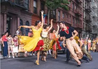  ?? NIKO TAVERNISE/20TH CENTURY STUDIOS VIA AP ?? Ariana DeBose as Anita, foreground left, and David Alvarez as Bernardo dance in “West Side Story.”