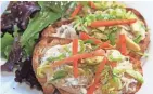  ?? ANGELA PETERSON, MILWAUKEE JOURNAL SENTINEL ?? The smoked walleye toast with brussels sprout slaw is a distinctiv­e small plate at Miss Molly's Cafe & Pastry Shop.