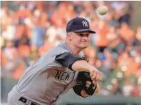  ?? KARL MERTON FERRON/BALTIMORE SUN ?? New York Yankees starting pitcher Clarke Schmidt kept the Baltimore Orioles at bay during an July 29 contest at Oriole Park at Camden Yards.