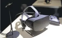  ?? ERIC RISBERG/ASSOCIATED PRESS ?? The Oculus Rift and touch controller­s cost $598 and an Oculus-ready laptop costs more than $1,000, according to the tech firm’s website.