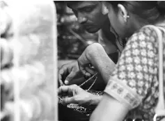  ??  ?? Indian customers browse items at a jewellery shop in New Delhi on May 8.