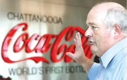  ?? STAFF PHOTOS BY ERIN O. SMITH ?? Darren Hodges, director of Coca-Cola United’s Tennessee Valley Division, speaks Monday during the 120th anniversar­y event for the Chattanoog­a Coca-Cola Bottling Co.