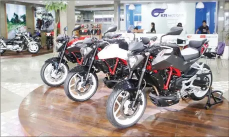  ?? PHA LINA ?? Motorbikes sit in KR Motors’ showroom yesterday at Koh Pich in Phnom Penh.