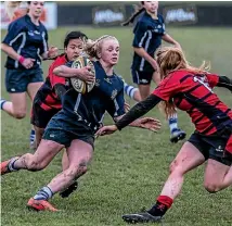  ?? PHOTO: DOUG FIELD/STUFF ?? Jorja Miller slices through the Mt Hutt- Ashburton College defence on the way to scoring one of her three tries for Timaru Girls’ High School in the Aoraki final.