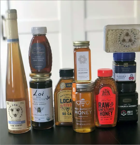  ?? KATIE WORKMAN VIA AP ?? This shows some of the many brands and types of honey available today. Honey isn’t just honey anymore. At farmers markets, grocery stores and restaurant­s, there’s a wide assortment of honeys with various colors and tastes.