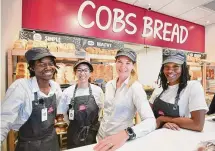  ?? Brian A. Pounds/Hearst Connecticu­t Media ?? From left; La’Tesia Gardner, Kiera Tejeda, Vice President Karen Frost-Spokes and Parris Patterson gather at the new COBS Bread bakery.