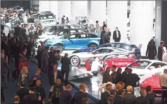  ??  ?? General view shows spectators visiting the hall in which Jaguar, Land Rover and Ferrari are exhibited at the Frankfurt Auto Show IAA in Frankfurt am Main, Germany on Sept 13. According to organisers, around 1,000
exhibitors from 39 countries will...