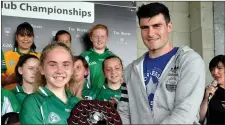  ??  ?? Sligo’s Pat Hughes presents trophy to Scoil Naomh Molaise captain.