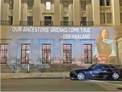  ?? LEAH SALGADO VIA AP ?? The image of U.S. Rep. Deb Haaland, D-N.M., is projected on the side of the U.S. Department of the Interior building Monday in Washington, D.C. Native Americans are closely watching the confirmati­on hearing this week for Haaland, who has been nominated to lead the Interior Department.
