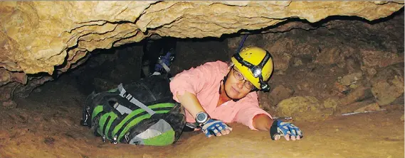  ?? PHOTOS: THE ASSOCIATED PRESS/FILES ?? NASA researcher Penelope Boston crawls in a New Mexico cave in 2008. Her team made its latest discovery in an abandoned mine in Mexico.