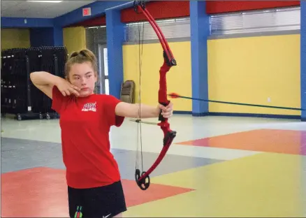  ?? MARK BUFFALO/RIVER VALLEY & OZARK EDITION ?? Bailey Mason of Maumelle practices archery at Pine Forrest Elementary School. Mason, who recently completed the fifth grade, finished fourth in the National Archery in School national championsh­ips in Louisville, Ky., with a score of 287 out of a possible 300 in the elementary division. Mason will take part in the world championsh­ips July 21 and 22 in Orlando, Fla.