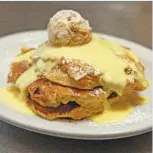  ?? ANTHONY VAZQUEZ/SUN-TIMES ?? Several favored dishes have come and gone over the years, but the bread-pudding pancakes have remained a mainstay at Southport Grocery and Cafe.